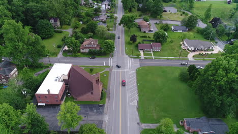 a cinematic slow forward and tilt up aerial establishing shot of a typical virginia small town