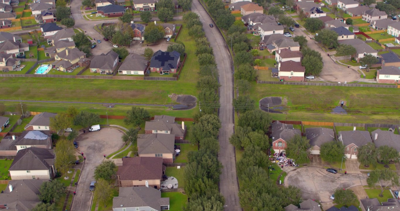 High angle drone view of suburban neighborhood in Missouri City