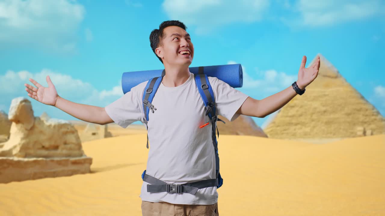Asian Male Hiker With Mountaineering Backpack Smiling And Spreading Arms Enjoy Looking The View Around While Traveling In Pyramid Of Giza