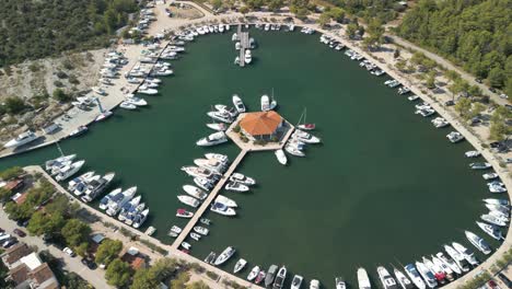 aerial footage with drone circling over a small marina