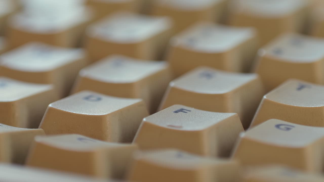 Man working and gaming on retro computer PC, IT engineer with vintage computer at home, using old fashion technology, close up of retro setup.