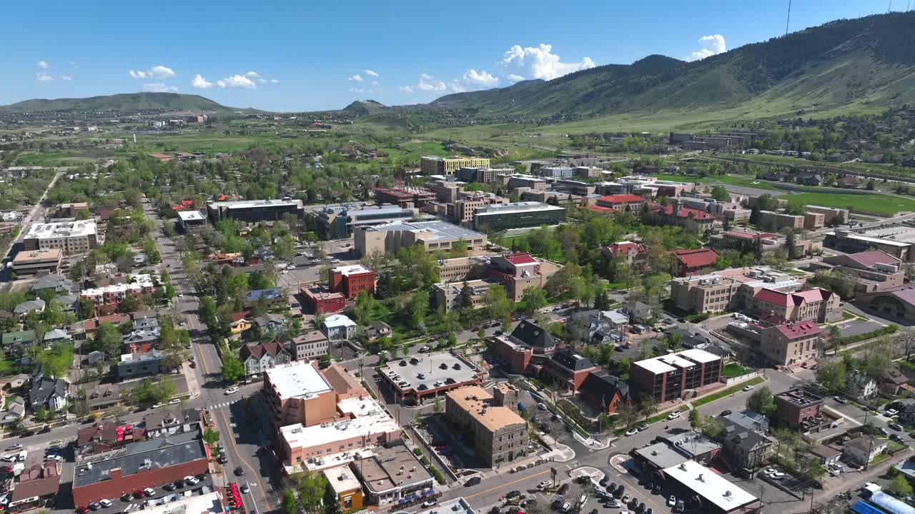 Aerial Drone Flyover of the town of Golden Colorado with Colorado school of mines and front range mountains visible