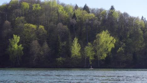 Stand-Up-Paddle-Boarding-in-a-Lake-in-Vilnius,-Lithuania