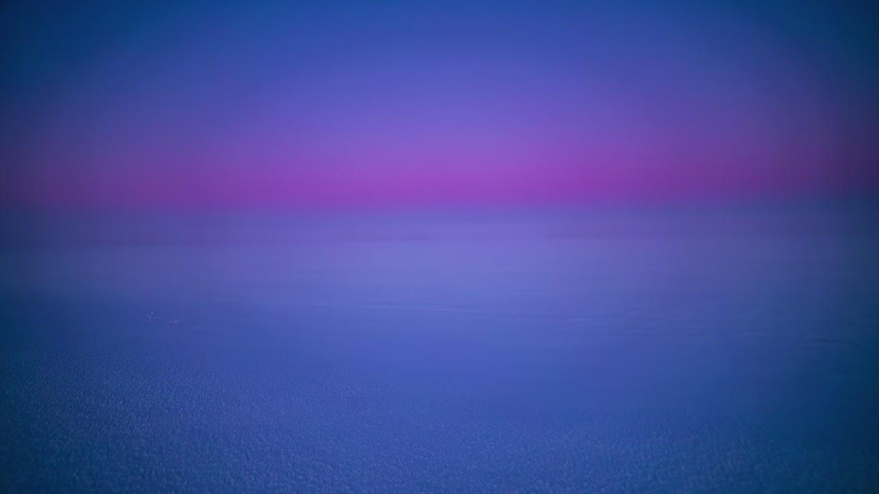 Timelapse shot of frozen lake covered with thick layers of fog during morning time