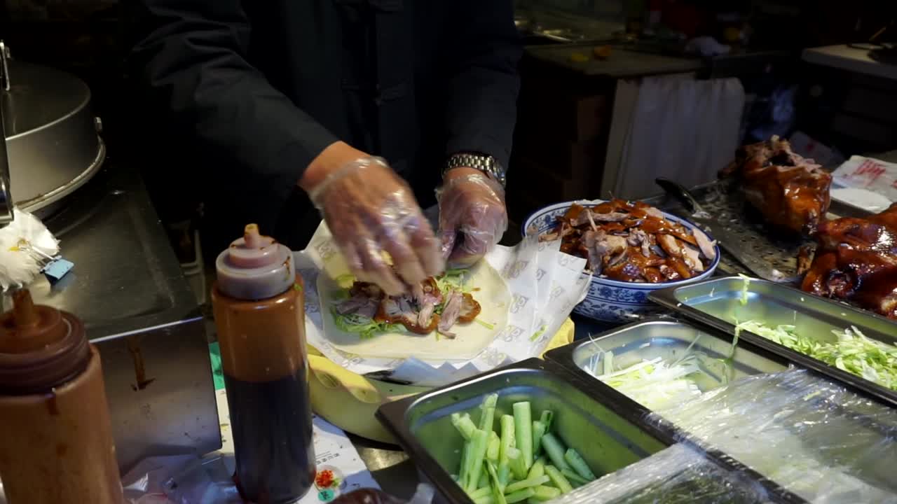 Beijing Peking Duck street food preparation in China