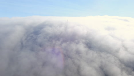 flying above dense clouds, dolly in