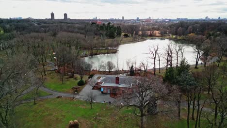 aerial flyover park with kissena lake in queens district of new york during sunny day