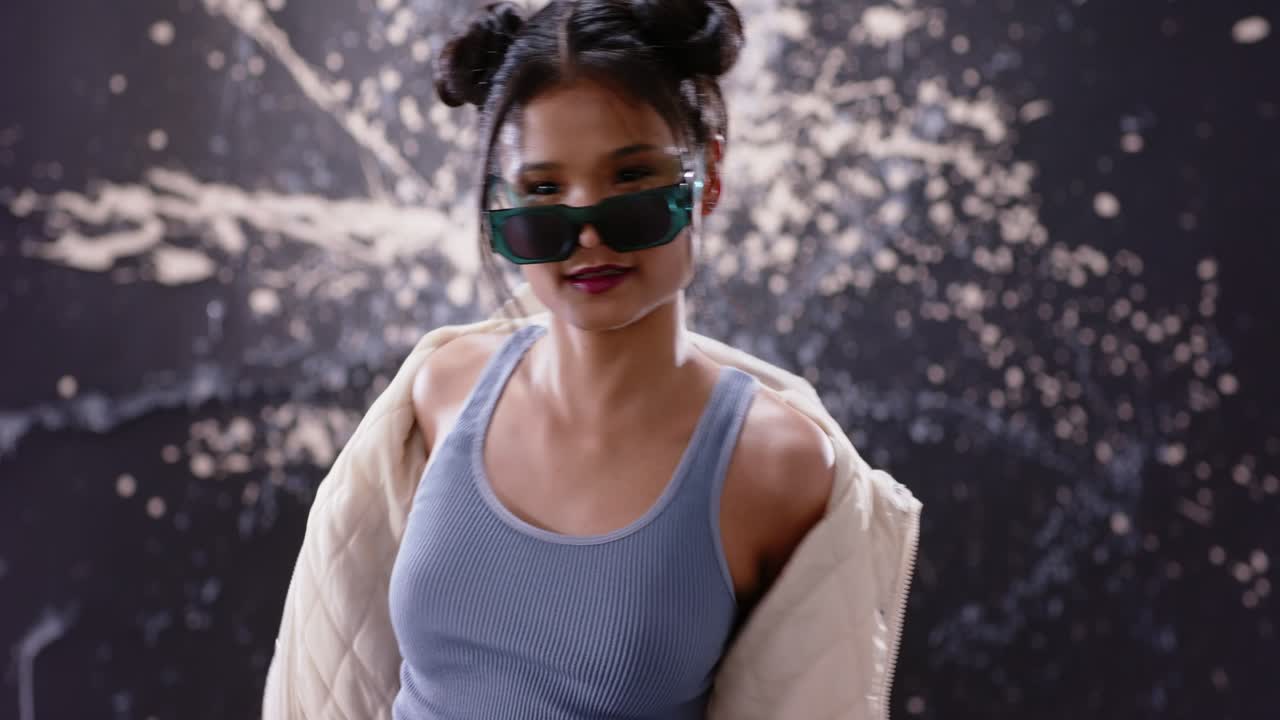 Stylish Young Asian Woman Posing in Sunglasses and Smiling