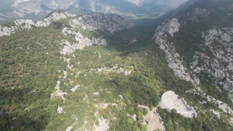 Wonderful-aerial-drone-shot-of-cloudy-mountains-in-Thermessos,-Antalya,-Turkey