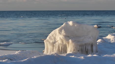 in the winter, stones are icy on the sea shore