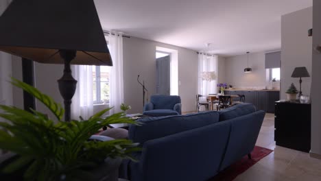 slow establishing shot of blue furniture in a villa in tresques, france