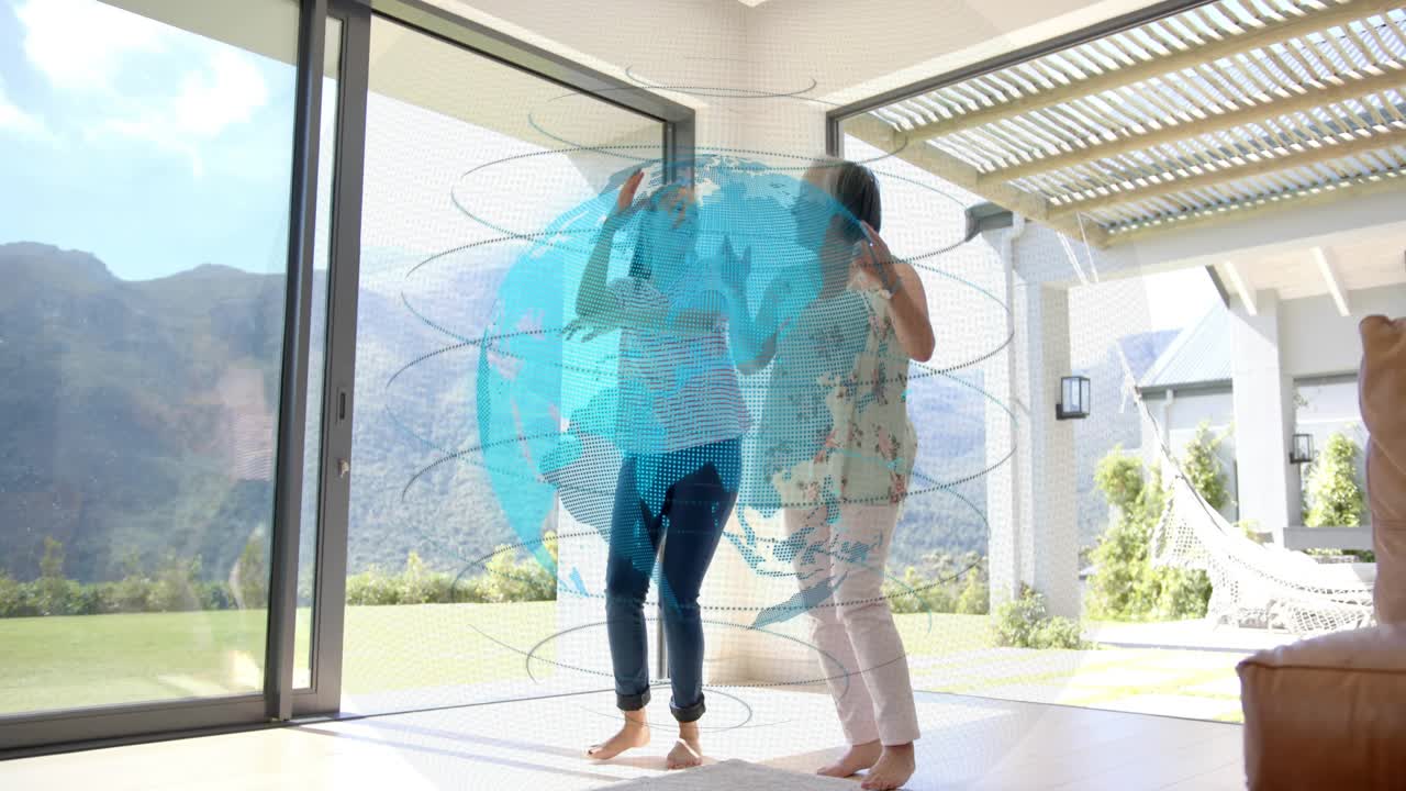 Mother guiding daughter, reaching, starting dancing by glass door with rotating tech globe passing