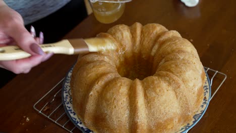 brushing a butter sugar glaze on a kentucky butter cake - pound cake series