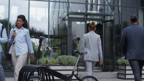 shared parking with electric scooter bicycle at modern business office center.