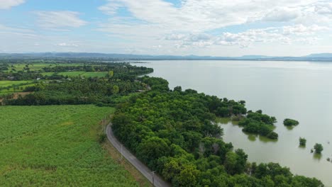 aerial view of rural landscape with lake and farmland