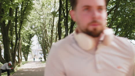 runner jogger man starting smart watch timer and running checking heart rate monitor before jogging