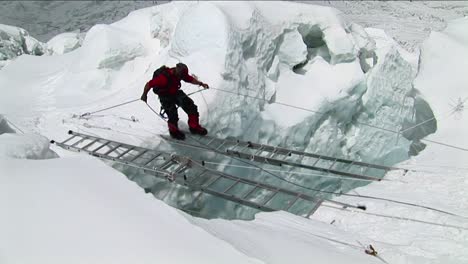 climber crossing large  ladders