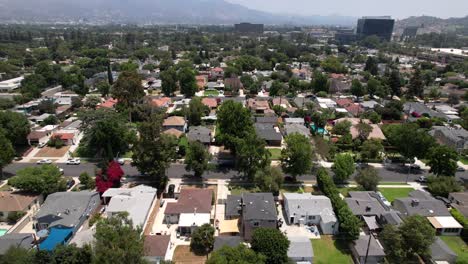 flying over a suburban neighborhood in burbank, california in summer