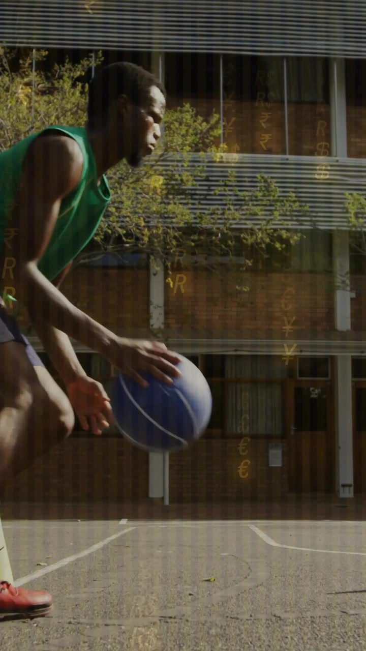 Vertical video: Man entering left frame and dribbling blue basketball across parking lot, training