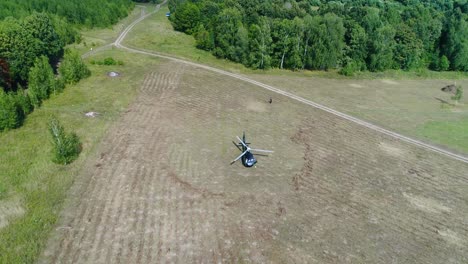 helicopter landing in a field