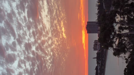 sunset timelapse and burning sky over anse vata beach, promenade roger laroque, new caledonia