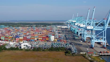 aerial video of port operations for a container ship being unloaded