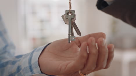 close-up-hands-real-estate-agent-giving-keys-to-new-house-client-successfully-purchasing-home-buying-property-enjoying-investment-4k-footage