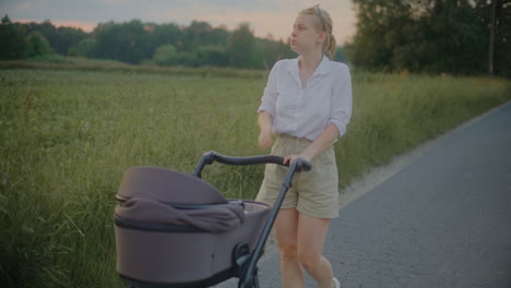 close-up of woman pushing stroller