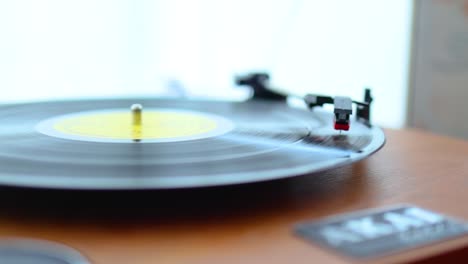 Close-up-of-vinyl-record-player-near-in-a-room-near-a-window