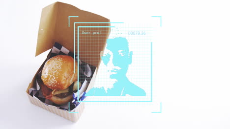 burger in box with digital face scan animation overlay on white background
