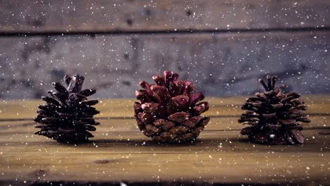 Fallender-Schnee-Mit-Weihnachtlichen-Tannenzapfendekorationen