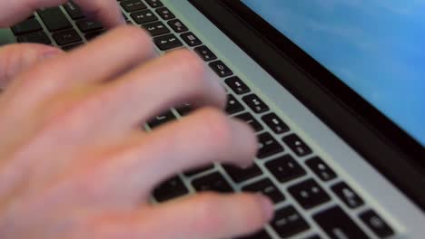 close up shot of both hands typing in a laptop keyboard-1