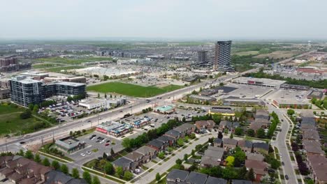 aerial shot of oakville shopping plazas and apartment buildings on a hazy summer day