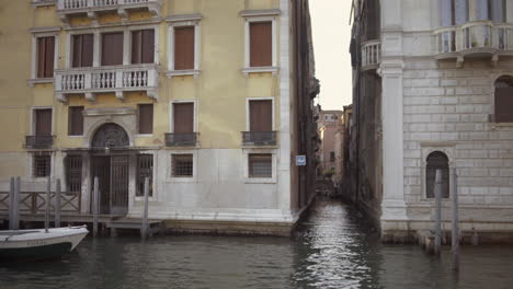 sailing near small canal in venice, italy