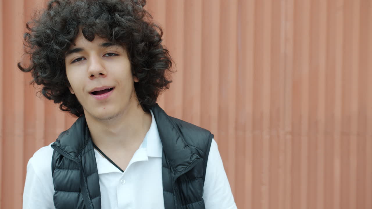 Teenager with Curly Hair Posing