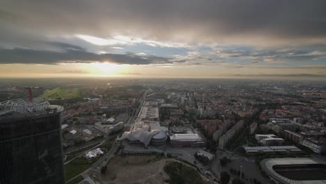 wide shot of milan cityscape during sunset, view from above