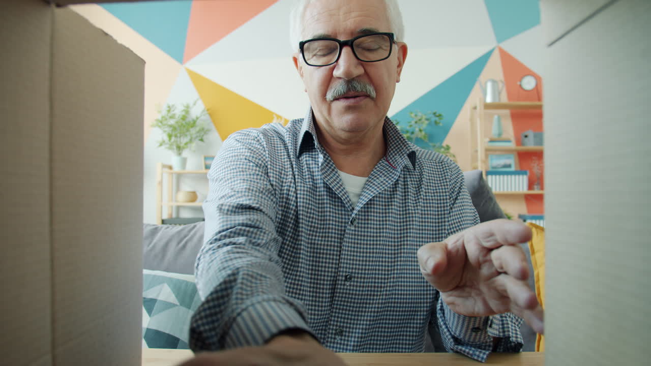 Senior Man Unboxing VR Headset