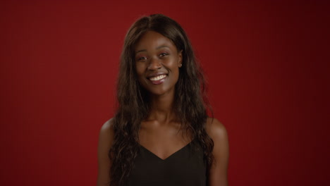 Smiling-Young-Woman-Looks-at-Camera