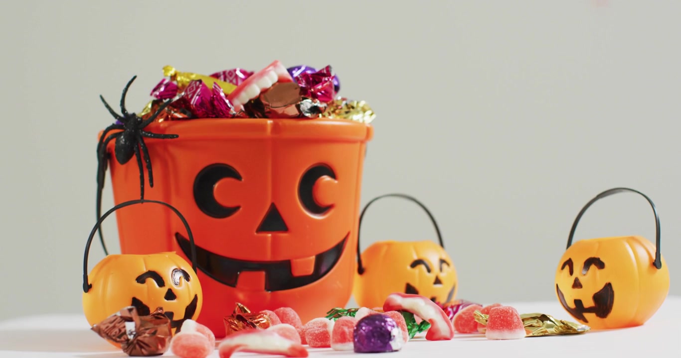 Thin red scan lines emerging and retracting across candy display, measuring bucket and pail heights
