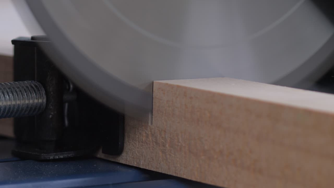 Close-up carpenter hands use electric fiber cutting wood. Building construction and industry concepts