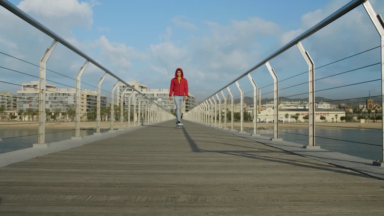Young attractive athlete running and doing exercises on Bridge in the morning.