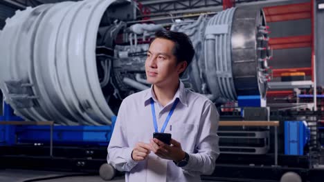 engineer reviewing a project in a manufacturing facility