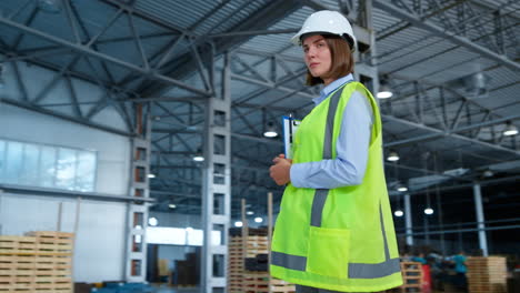 Happy-portrait-warehouse-worker-enjoying-work-process-managing-shipment-delivery