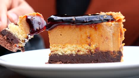 close up of a delicious slice of chocolate cake with caramel sauce