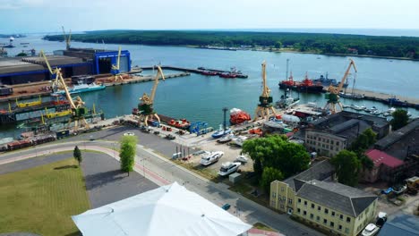 aerial view of port of klaipeda with docked ships and loader crane - lithuania