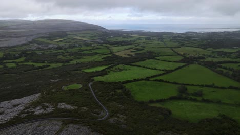 the burren in ireland with rocky hills and green fields