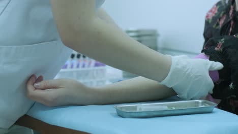 blood collection, nurse taking blood sample for analysis. nurse taking a blood sample for medical examinations. the doctor or nurse will take a blood sample from a vein for testing.