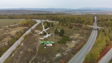 Aerial-panning-footage-of-military-airplanes-outdoor-museum-exhibition-1