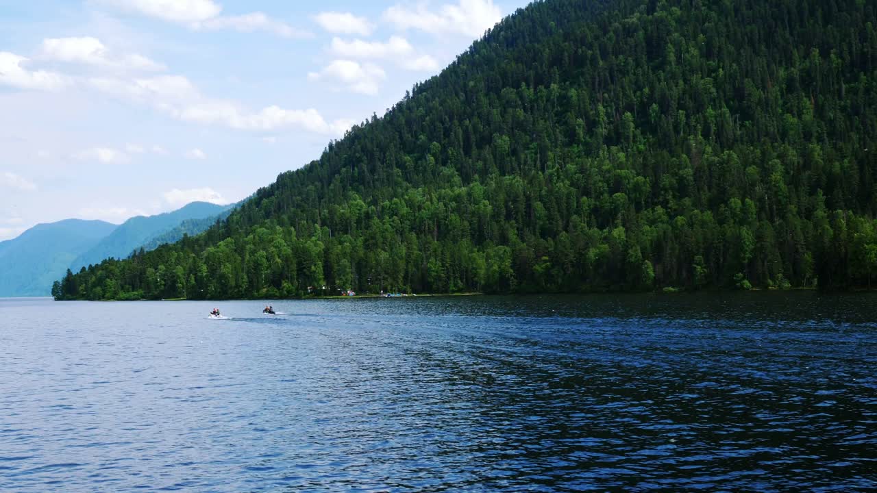 Serene Mountain Lake Scenery with Boats
