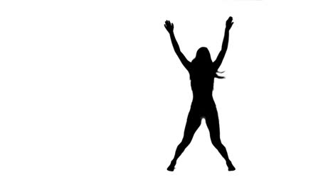 Silhouette-of-a-woman-doing-star-jumps